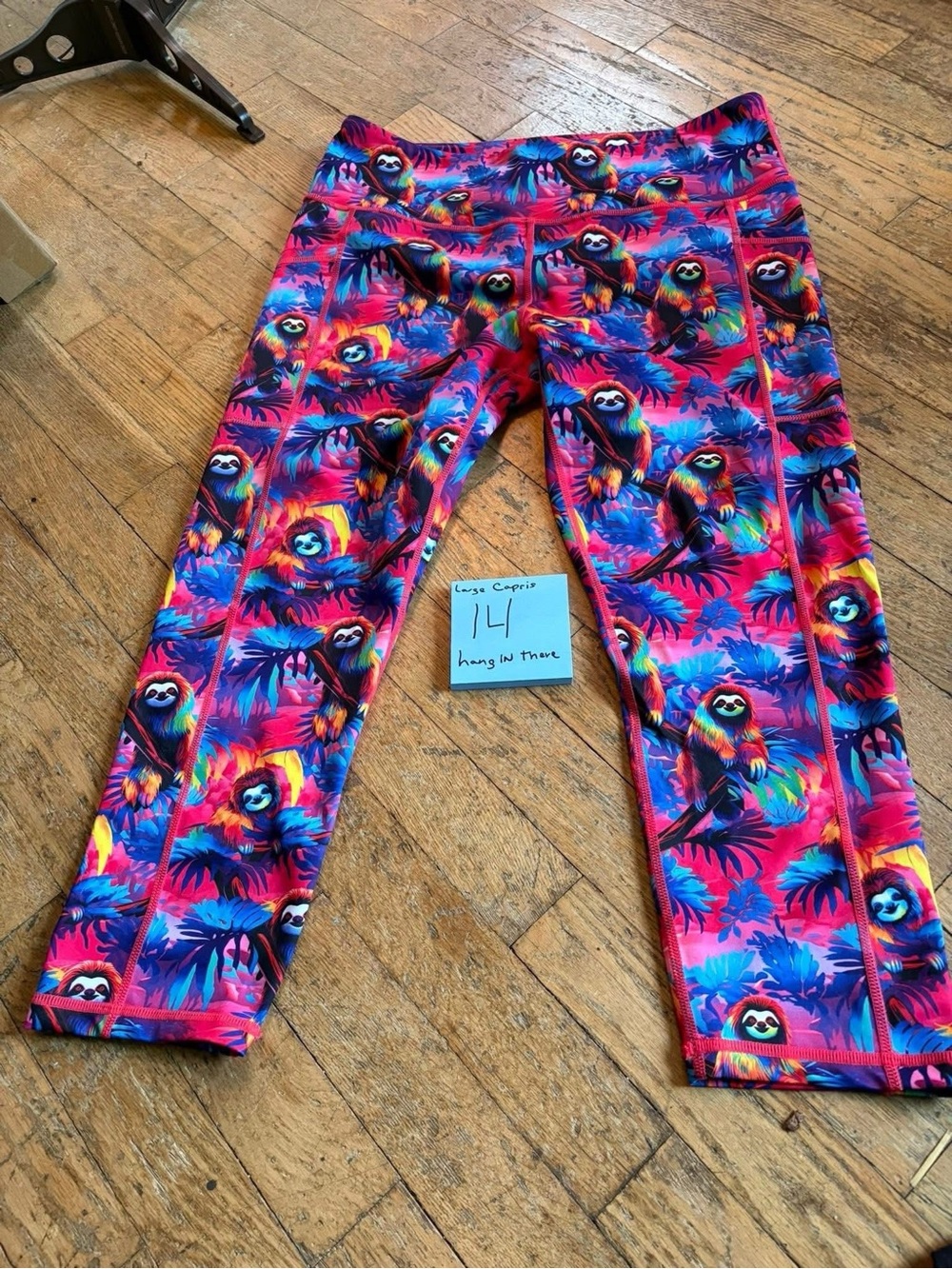 Constantly Varied Gears Multicolor Sloth Print Capri Leggings Hang in there